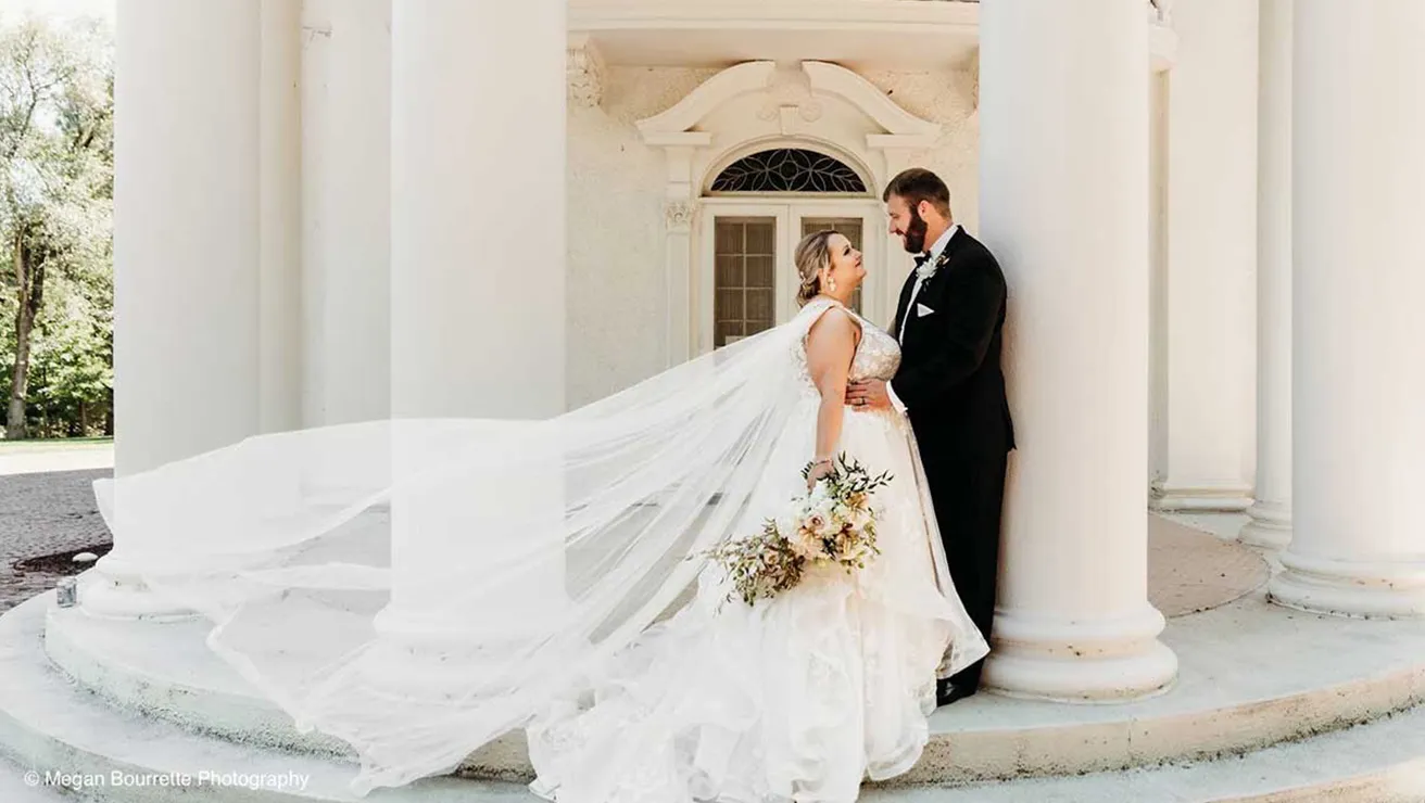 Couple in front of Arbor Lodge